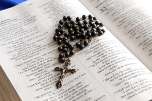 Rosary on bible